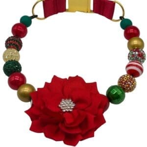 Festive dog collar with red flower and beads.