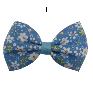 Blue floral bow tie with white and green flowers.