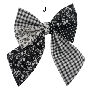 Black and white patterned fabric hair bow.