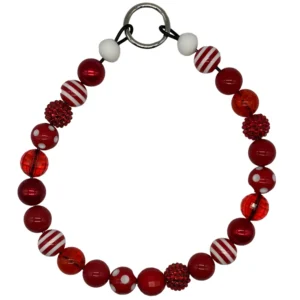 Red and white beaded bracelet with metal ring.
