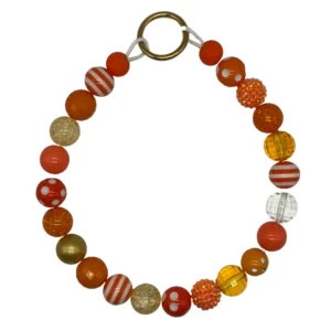Colorful beaded bracelet with orange and gold beads.