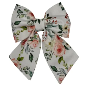 Floral fabric bow with pink roses design.