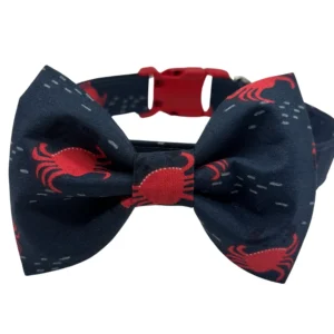 Navy bow tie with red crab pattern.