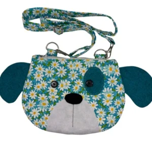 Dog-shaped floral handbag with blue ears and strap.