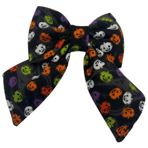 Halloween-themed bow with colorful pumpkin pattern.