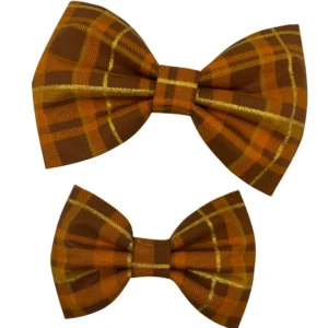 Two brown plaid fabric bows with gold accents.