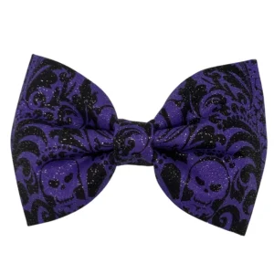 Purple bow tie with skull pattern.