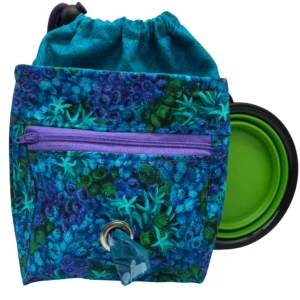 Colorful bag with poop bag dispenser and collapsible bowl.