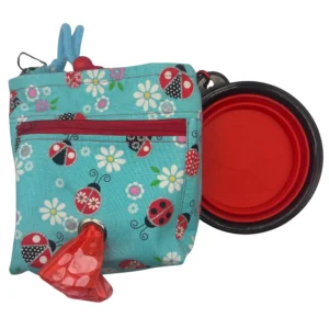 Ladybug-patterned pouch with a red pop-out lid.