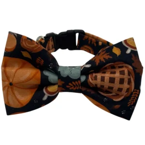 Autumn-themed dog bow tie with pumpkin design.
