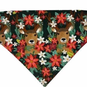 Deer among vibrant red and white flowers.