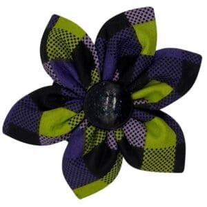 Purple and green patterned fabric flower brooch.