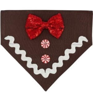 Dog bandana with gingerbread design and red bow.