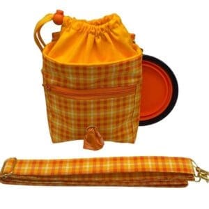 Checkered drawstring bag with strap and collapsible bowl.