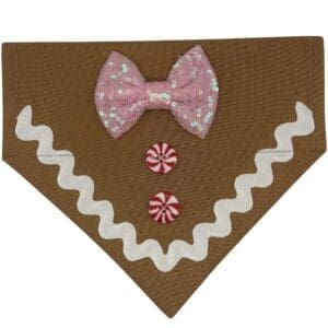Brown dog bandana with pink bow and buttons.