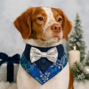Dog in snow-themed bandana and bow tie.