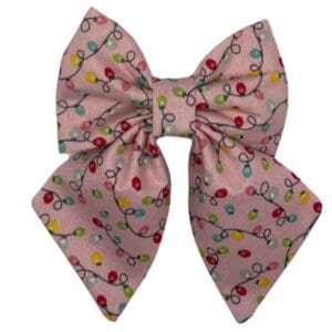 Pink bow with colorful string lights pattern.