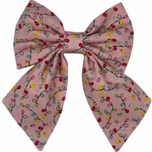 Pink bow with colorful Christmas lights pattern.