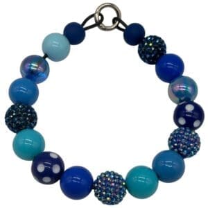Blue beaded bracelet with various textures.
