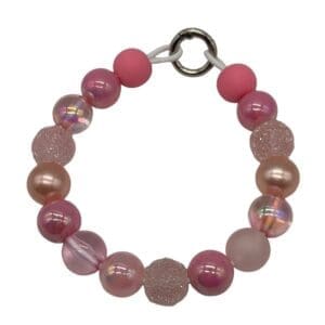 Pink beaded bracelet on white background.