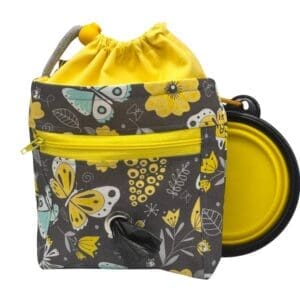 Floral butterfly dog treat bag with poop dispenser.