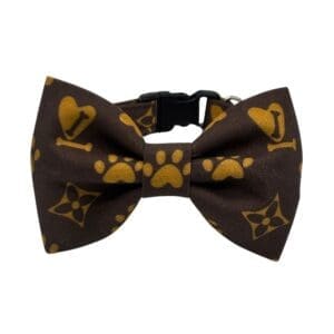 Brown pet bow tie with yellow paw prints.
